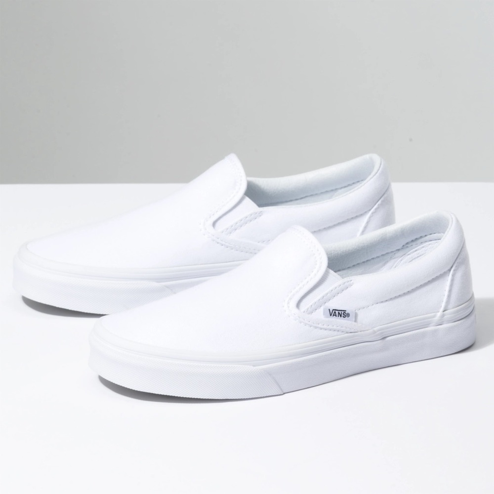 Vans white slip ons